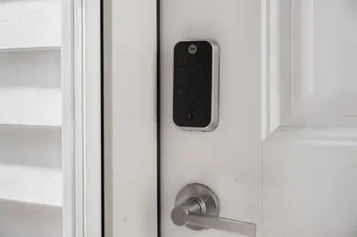 a door handle with a remote control on it at The Cabin Sleep in Edmonton