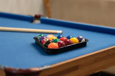 a tray of billiard balls on a pool table at Honeyville House Sleeps 8 Pool Table in Edmonton