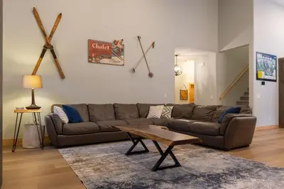 a living room with a couch and a coffee table at Moose Lodge by Fernie Central Reservations in Fernie