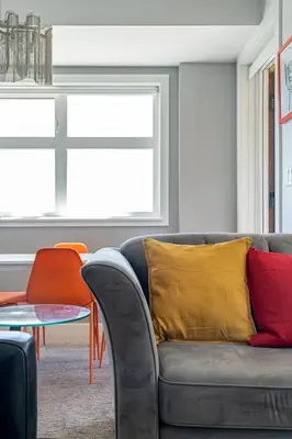 a living room with a couch and a table at Delightful 2 BR And 2 Bath Water View in Downtown in Calgary