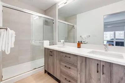 a bathroom with a sink and a shower at Lovely 3BR unit in the heart of Calgary in Calgary