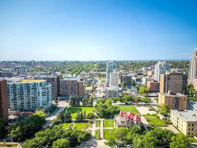 an aerial view of a city with buildings at Modern 1BR City Escape with Balcony near DT Calgary in Calgary