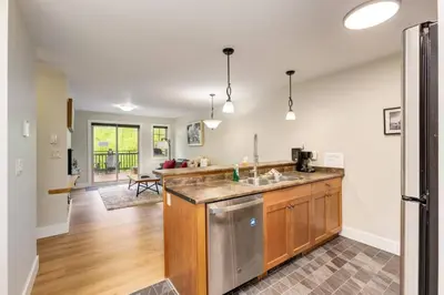 a kitchen with a sink and a counter top at Rockies Escape Skiing Hiking and Private Hot Tub in Golden