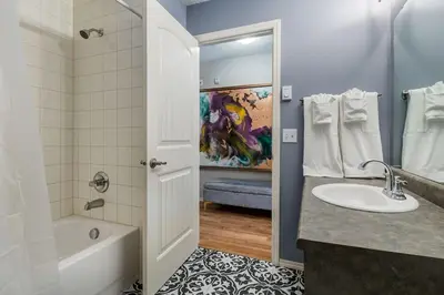 a bathroom with a sink and a bath tub at Cozy getaway for exploring Canmore and Banff in Canmore
