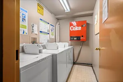 a bathroom with a coke sign on the wall at The Most Perfect Stay in Canmore with Mountain View in Canmore
