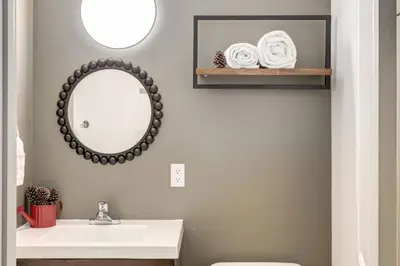 a bathroom with a sink and a mirror at Peaceful Mountain Getaway in Canmore near Banff in Canmore