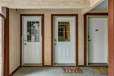 two white doors on a house with at The Perfect Getaway for Exploring Canmore and Banff) in Canmore