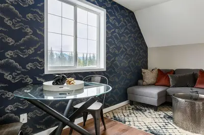 a living room with a table and a couch at The Perfect Getaway for Exploring Canmore and Banff) in Canmore