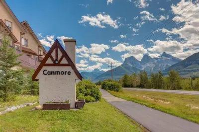 a sign that reads camprance next to a road at Charming and Stylish renovated Condo near Banff in Canmore