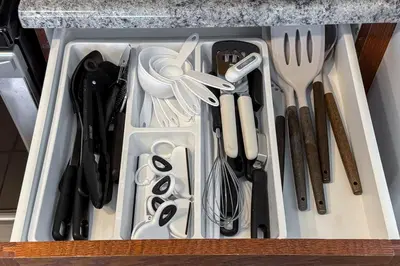 a drawer filled with utensils in a kitchen at Downtown Edmonton Suite: 5-Min Drive to Rogers in Edmonton