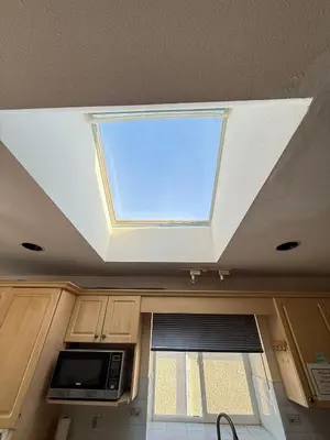 a skylight in the ceiling of a kitchen with a window at Cozy Private Room near Langara College Skytrain Station in Vancouver