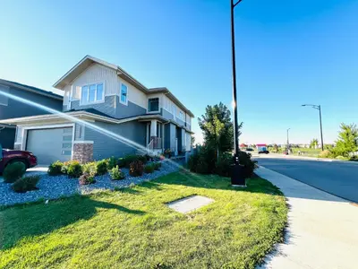 a house on the side of a street at West Edmonton- Rose in Edmonton