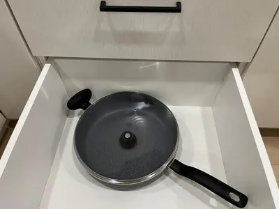 a black bowl sitting on a counter in a drawer at cozy basement suite with 1-bed, wi-fi & Neflix in Edmonton