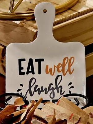 a sign that says eat well english on a shelf at Cloud 9 Inn in Whitecourt