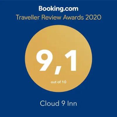 a yellow circle with the number in it at Cloud 9 Inn in Whitecourt