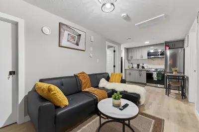a living room with a couch and a table at Guest Suite in Edmonton, King bed and parking in Edmonton