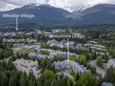 an aerial view of a city with mountains and trees at 1BR + Sofa Bed | Greystone Lodge | Ski in / Ski out | Pool & Hot Tub | Epic Locations in Whistler