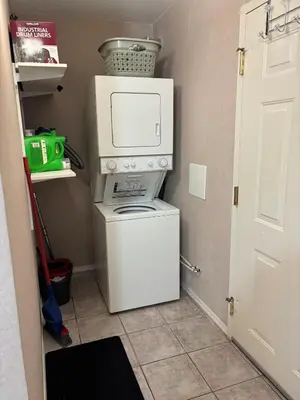 a washer and dryer in a laundry room with at Cozy getaway with a view! in Fairmont Hot Springs
