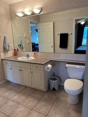 a bathroom with a sink and a toilet and a mirror at Cozy getaway with a view! in Fairmont Hot Springs
