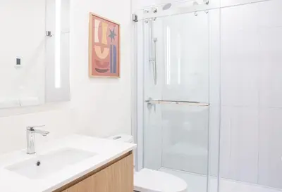 a bathroom with a shower and a sink and a toilet at Revel and Rest by Revelstoke Vacations in Revelstoke