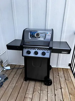 a stove top oven sitting on top of a wooden floor at Mountain Retreat with Views and Hot Tub Near Banff Gates in Canmore