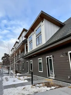 an apartment building with a building at Mountain Retreat with Views and Hot Tub Near Banff Gates in Canmore