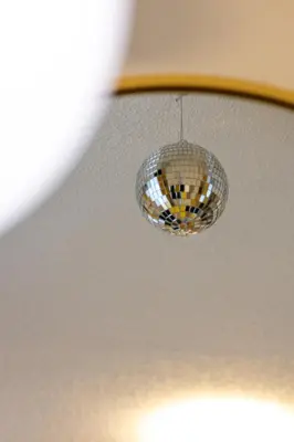a disco ball is hanging from a ceiling at Quiet Yellow Unit- Stampede, BMO, Nightlife Etc. in Calgary