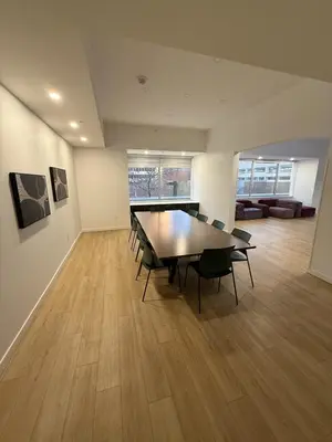 a dining room with a table and chairs at Luxury Downtown One Bedroom with Skyline Views and Free Parking in Edmonton