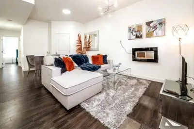 a living room with a couch and a fireplace at 3BDRM Winter Haven - King Beds - Fireplace - Garage in Edmonton