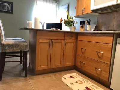 a kitchen with a counter and a kitchen island at Eagles Nest Lodging in Hinton