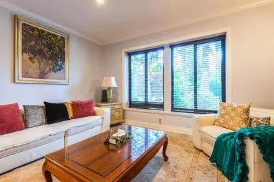 a living room with a couch and a coffee table at Luxury Home by White Rock in Surrey