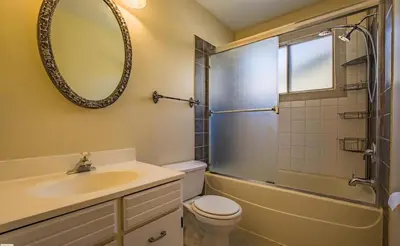 a bathroom with a sink and a toilet and a shower at Fully furnished House near GrayNuns, Millwoods in Edmonton
