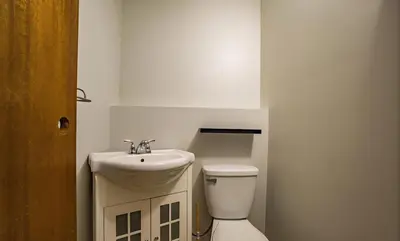 a white bathroom with a sink and a toilet at All what you need in a House near GrayNuns, Millwoods in Edmonton