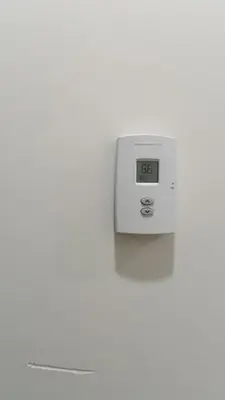 a clock on a white wall with a clock on it at Vancouver Downtown Guest House- Walk to Skytrain & BC Place- Free Parking in Vancouver