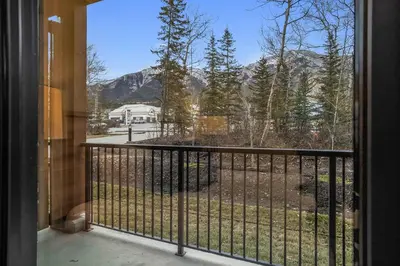 a balcony with a view of a mountain at King Beds Fire Place New Build in Canmore
