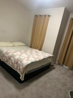 a bedroom with a bed in a room at Private room in Edmonton