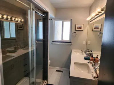 a bathroom with a glass shower and a sink at Vancouver house 3 bedrooms and balcony Perfect for your business trip to Vancouver in Vancouver