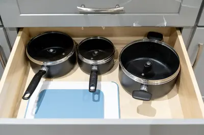 two pots sitting on a stove in a kitchen at New Modern 2BR Suite near UBC Pacific Spirit Park in Vancouver