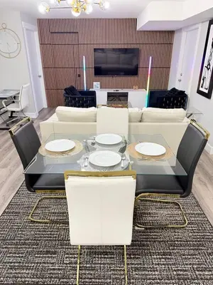 a living room with a table and a couch at True Haven Deluxe in Prince George