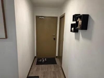 a room with a hallway with shoes on the floor at Breath-Taking-View-5 Guest DTskyline-18th Floor in Calgary