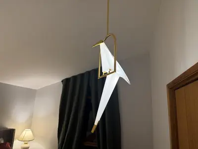 a white umbrella hanging from a wall at Bragg Creek Vacation Estate with hot tub, sauna, pool table, karaoke, private pond and forest trails in Bragg Creek