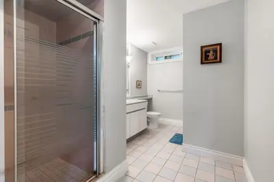 a bathroom with a shower and a toilet at Comfortable Family Home,South Granville in Vancouver