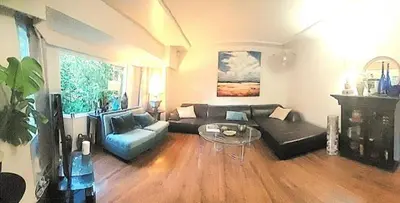 a living room with a couch and a table at Quiet Furnished Room Near Transit and Hospital long stays in Surrey
