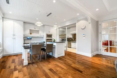 a kitchen and dining room with a table and chairs at An Amazing StarHouse in Westside Vancouver in Vancouver