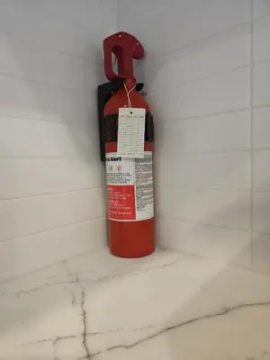 a fire hydrant in a corner of a wall at Shaganappi 2BR with private Baths, Walk to CTrain, Garage Parking, Full Kitchen in Calgary