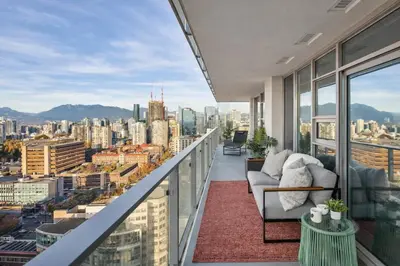a balcony with a view of a city at Downtown 2-Bedroom Apartment with Beautiful City Views in Vancouver