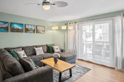 a living room with a couch and a table at 2 Bedroom Condo Banff, Canmore sleeps 6 comfortably in Canmore