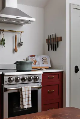 a kitchen with a stove with a pot on it at The Garden Studio in Victoria