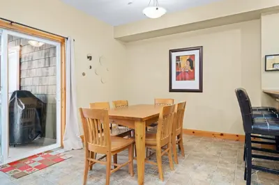 a dining room with a wooden table and chairs at 2BR Kimberley Escape with Private Hot Tub and BBQ in Kimberley
