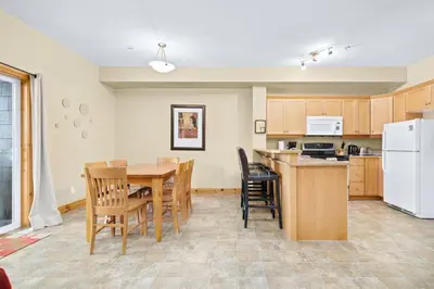 a kitchen and dining room with a table and chairs at 2BR Kimberley Escape with Private Hot Tub and BBQ in Kimberley